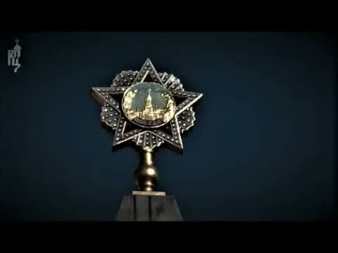 Patriarch Kirill offering the Holy Cross at a monument glorifying the Red Antichrist